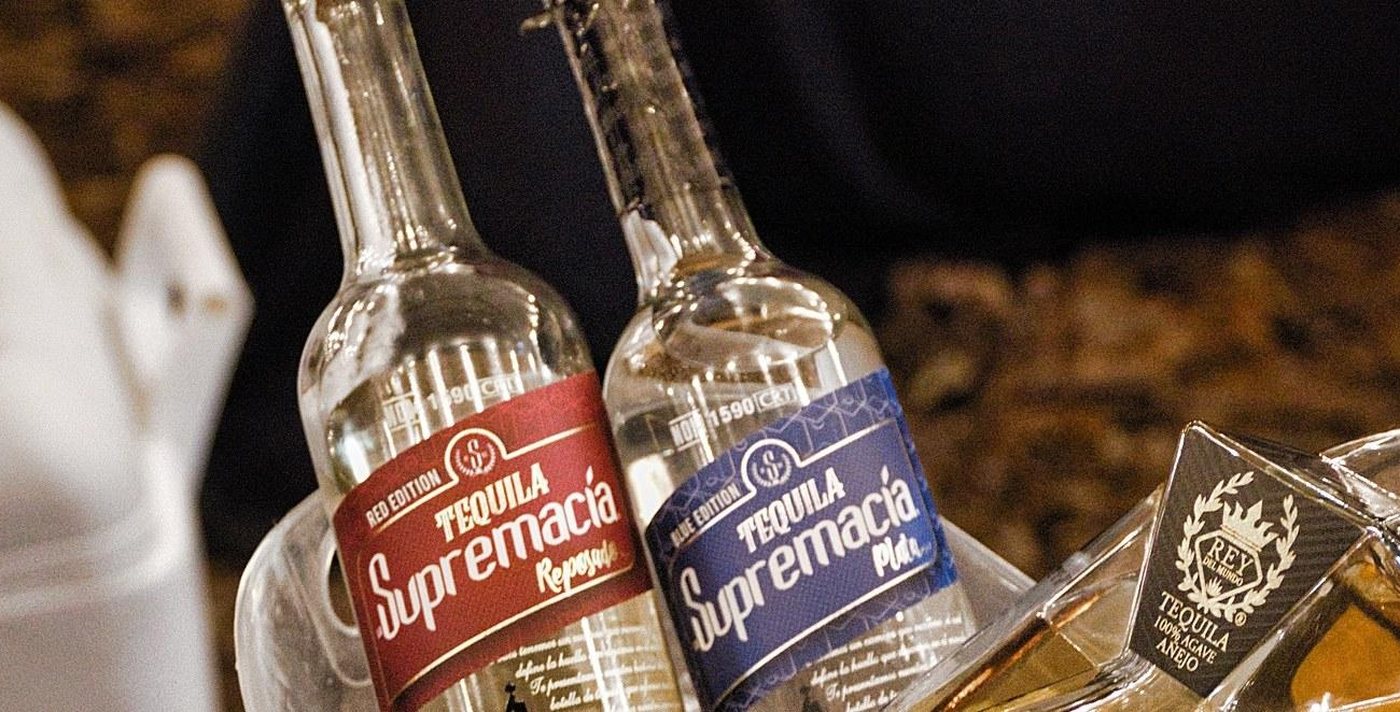 La Supremacía Tequila bottles at an event